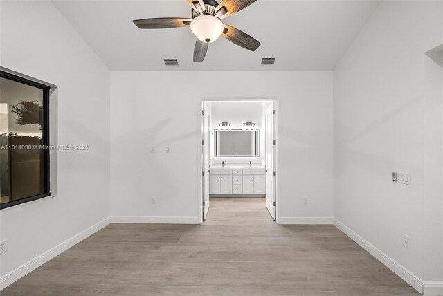 4308 3rd St SW, Lehigh Acres, FL 33976 - spare room featuring a ceiling fan, light wood finished floors, and baseboards