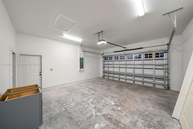 4308 3rd St SW, Lehigh Acres, FL 33976 - garage with electric panel and a garage door opener