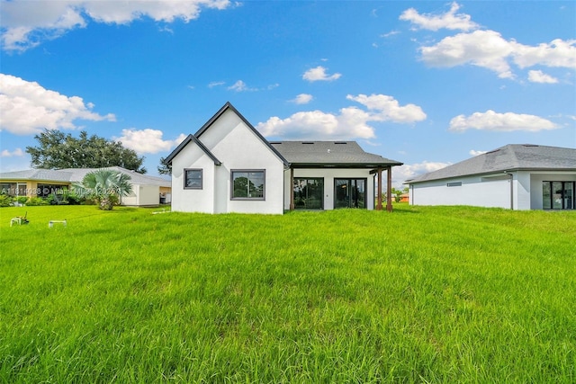 4308 3rd St SW, Lehigh Acres, FL 33976 - rear view of house with a yard