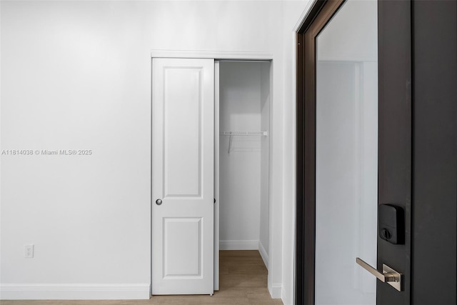 4308 3rd St SW, Lehigh Acres, FL 33976 - hallway featuring baseboards and light wood finished floors