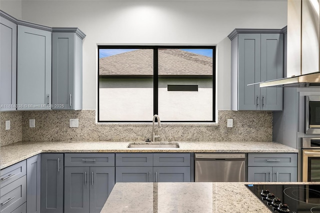 4308 3rd St SW, Lehigh Acres, FL 33976 - kitchen with a sink, stainless steel appliances, gray cabinetry, and wall chimney range hood