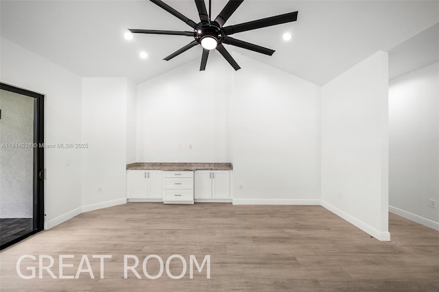 4308 3rd St SW, Lehigh Acres, FL 33976 - empty room with a ceiling fan, baseboards, lofted ceiling, light wood-style floors, and recessed lighting
