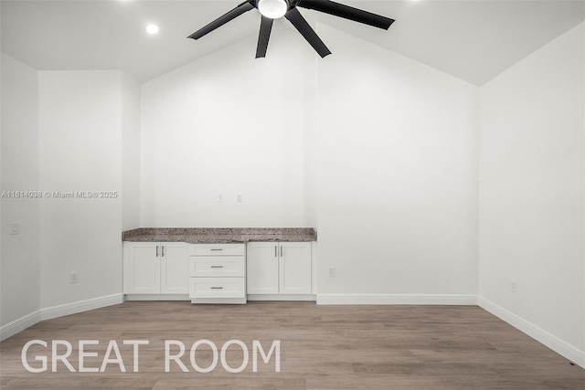 4308 3rd St SW, Lehigh Acres, FL 33976 - unfurnished office featuring a ceiling fan, light wood-type flooring, baseboards, recessed lighting, and high vaulted ceiling