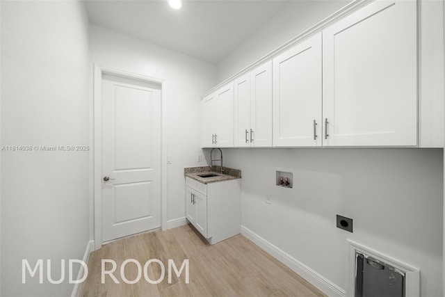 4308 3rd St SW, Lehigh Acres, FL 33976 - laundry area featuring cabinet space, hookup for an electric dryer, light wood-style flooring, baseboards, and hookup for a washing machine