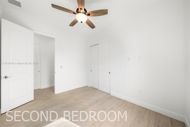 4308 3rd St SW, Lehigh Acres, FL 33976 - unfurnished bedroom with light wood-style floors, baseboards, and a closet