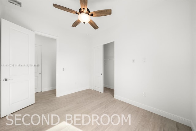 4308 3rd St SW, Lehigh Acres, FL 33976 - unfurnished bedroom featuring light wood-type flooring, baseboards, and a closet