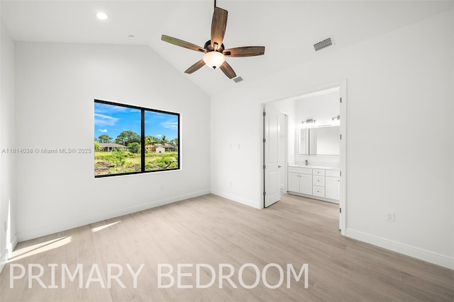 4308 3rd St SW, Lehigh Acres, FL 33976 - unfurnished bedroom featuring light wood-type flooring, vaulted ceiling, baseboards, ensuite bathroom, and recessed lighting