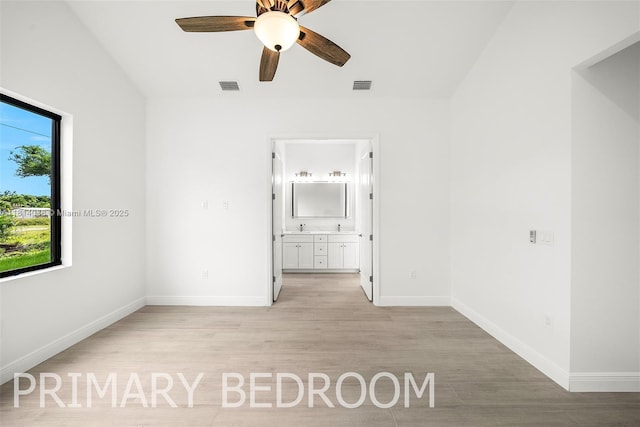 4308 3rd St SW, Lehigh Acres, FL 33976 - unfurnished bedroom with light wood-style flooring, baseboards, connected bathroom, and ceiling fan