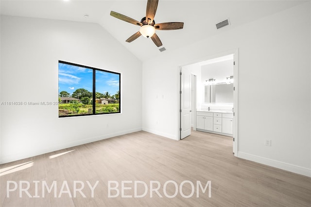 4308 3rd St SW, Lehigh Acres, FL 33976 - unfurnished bedroom featuring light wood finished floors, ensuite bath, baseboards, high vaulted ceiling, and ceiling fan