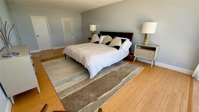 900 Bay Dr Unit 727-725, Miami Beach, FL 33141 - bedroom featuring light wood-style floors and baseboards