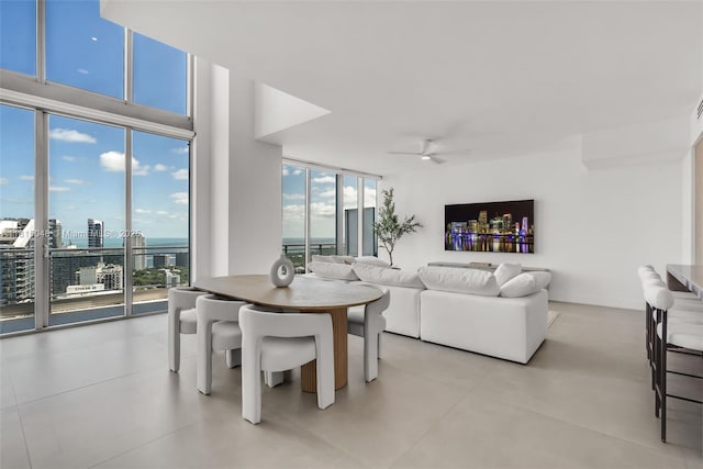92 SW 3rd St Unit 5204, Miami, FL 33130 - dining room featuring ceiling fan, a wall of windows, and a city view