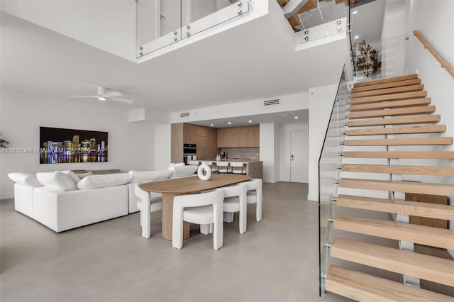92 SW 3rd St Unit 5204, Miami, FL 33130 - dining space featuring stairs, concrete floors, ceiling fan, and recessed lighting
