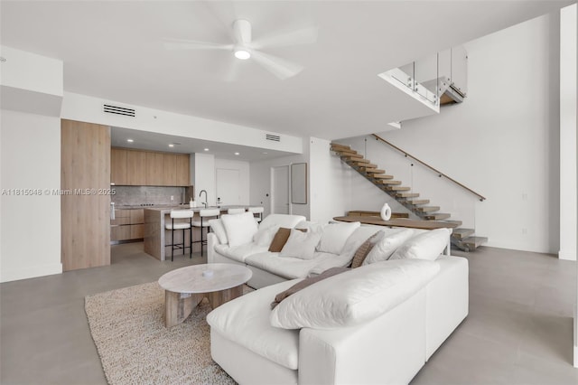 92 SW 3rd St Unit 5204, Miami, FL 33130 - living area featuring wet bar, stairway, a ceiling fan, finished concrete floors, and recessed lighting