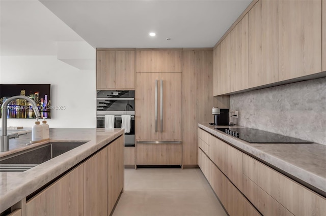 92 SW 3rd St Unit 5204, Miami, FL 33130 - kitchen with light brown cabinetry, a sink, black electric stovetop, backsplash, and recessed lighting