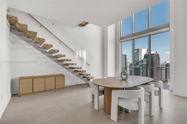 92 SW 3rd St Unit 5204, Miami, FL 33130 - dining room with a towering ceiling, stairway, and a city view