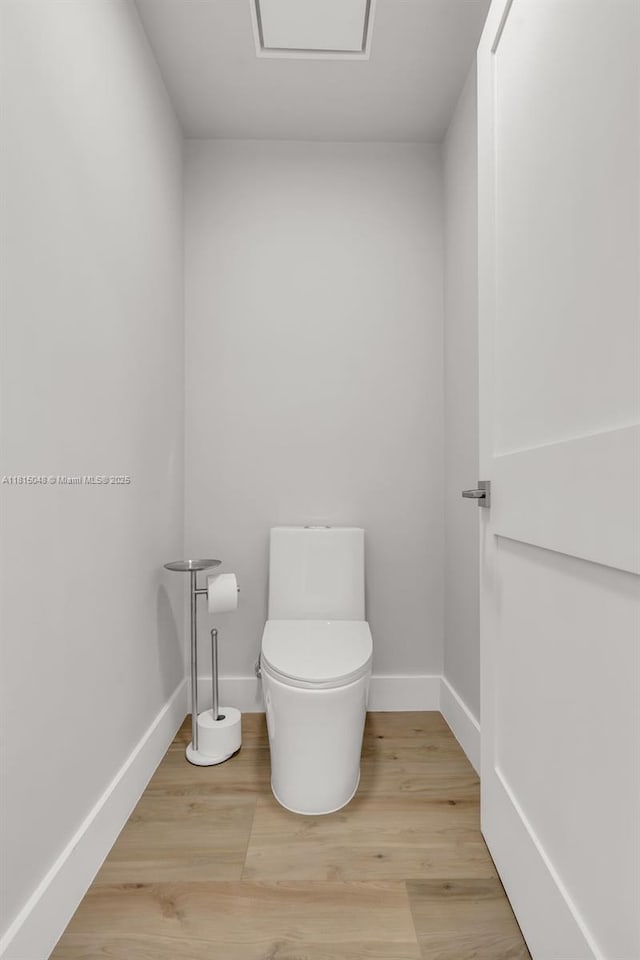 92 SW 3rd St Unit 5204, Miami, FL 33130 - bathroom with toilet, wood finished floors, and baseboards