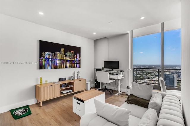 92 SW 3rd St Unit 5204, Miami, FL 33130 - living room with light wood-type flooring, an office area, baseboards, recessed lighting, and expansive windows