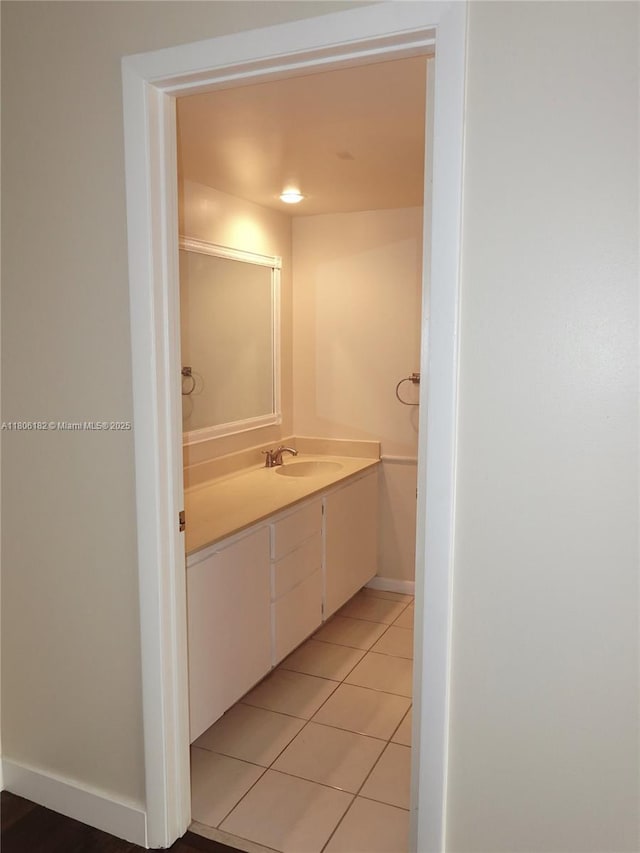 4226 42nd Way, West Palm Beach, FL 33407 - bathroom featuring vanity, tile patterned flooring, and baseboards