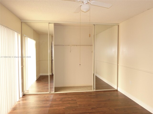 4226 42nd Way, West Palm Beach, FL 33407 - unfurnished bedroom with wood finished floors, a closet, and a ceiling fan