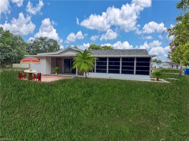 2016 Mariner Ct, La Belle, FL 33935 - rear view of house featuring a yard and a sunroom