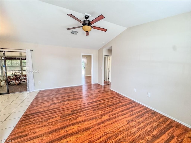 2016 Mariner Ct, La Belle, FL 33935 - spare room with lofted ceiling, a ceiling fan, baseboards, and light wood finished floors