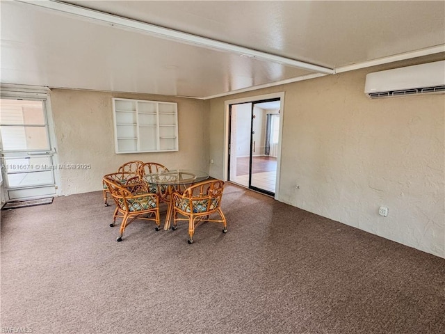2016 Mariner Ct, La Belle, FL 33935 - dining area featuring a wall unit AC, a textured wall, and carpet