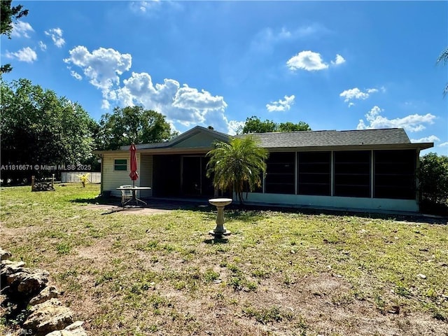 2016 Mariner Ct, La Belle, FL 33935 - back of house featuring a sunroom