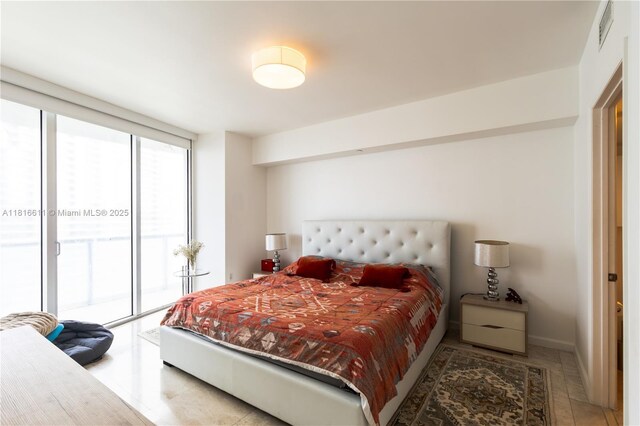 475 Brickell Ave Unit 3512, Miami, FL 33131 - tiled bedroom featuring access to exterior