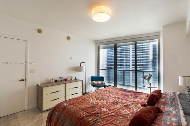 475 Brickell Ave Unit 3512, Miami, FL 33131 - bedroom with access to outside and light tile patterned floors
