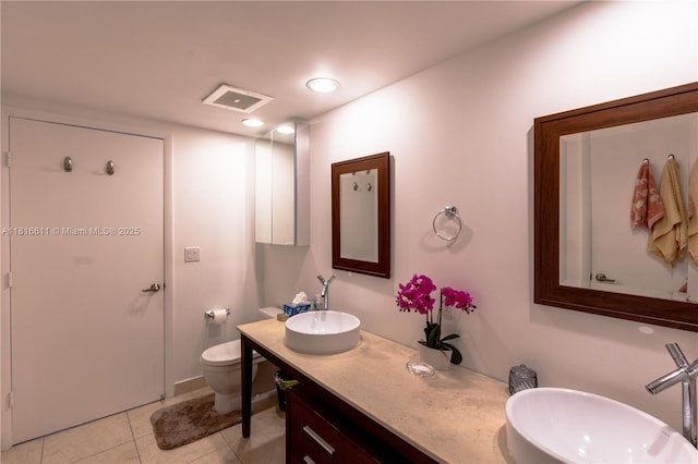 475 Brickell Ave Unit 3512, Miami, FL 33131 - full bath featuring toilet, tile patterned floors, double vanity, and recessed lighting