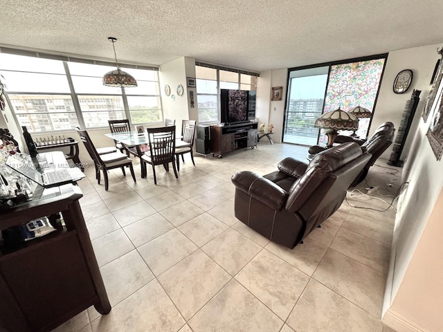 1100 Saint Charles Pl Unit 712, Pembroke Pines, FL 33026 - living room with a textured ceiling, plenty of natural light, and light tile patterned floors