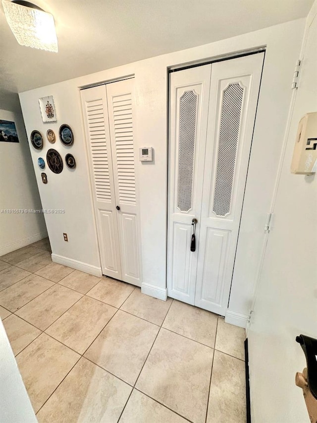 1100 Saint Charles Pl Unit 712, Pembroke Pines, FL 33026 - foyer entrance with light tile patterned floors and baseboards