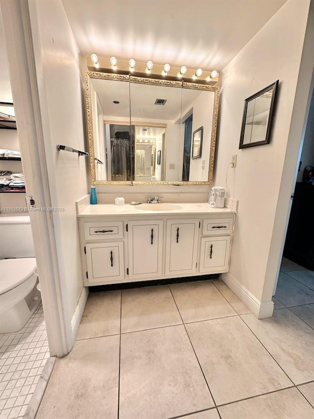 1100 Saint Charles Pl Unit 712, Pembroke Pines, FL 33026 - bathroom featuring tile patterned floors, vanity, toilet, and baseboards