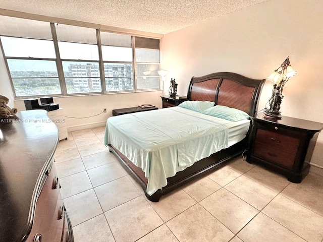 1100 Saint Charles Pl Unit 712, Pembroke Pines, FL 33026 - bedroom featuring light tile patterned floors and a textured ceiling