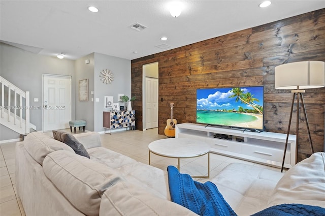 4164 Cascada Cir, Cooper City, FL 33024 - living area with wood walls, stairway, an accent wall, tile patterned flooring, and recessed lighting