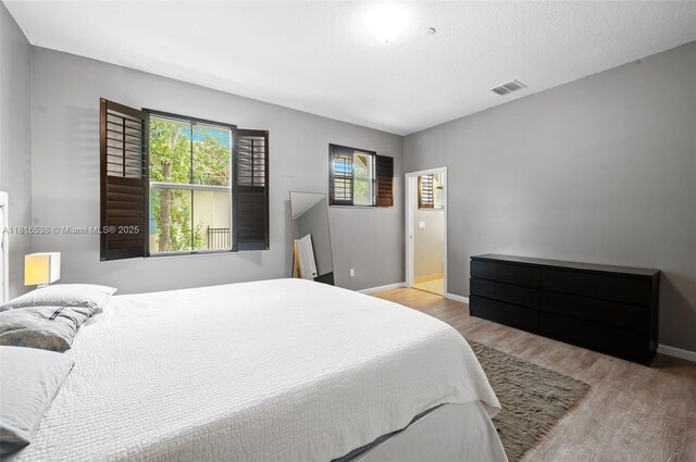 4164 Cascada Cir, Cooper City, FL 33024 - bedroom featuring wood finished floors and baseboards