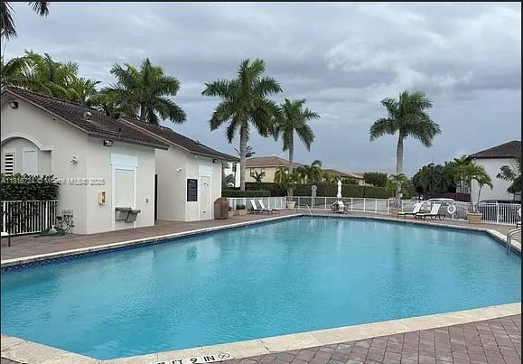 11603 NW 89th St Unit 214, Doral, FL 33178 - community pool featuring a patio area