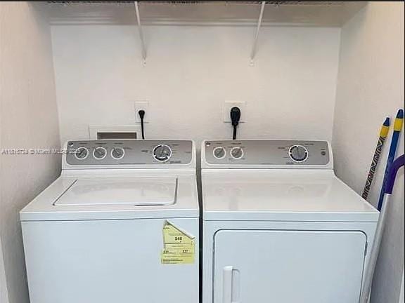 11603 NW 89th St Unit 214, Doral, FL 33178 - laundry room featuring washer and clothes dryer