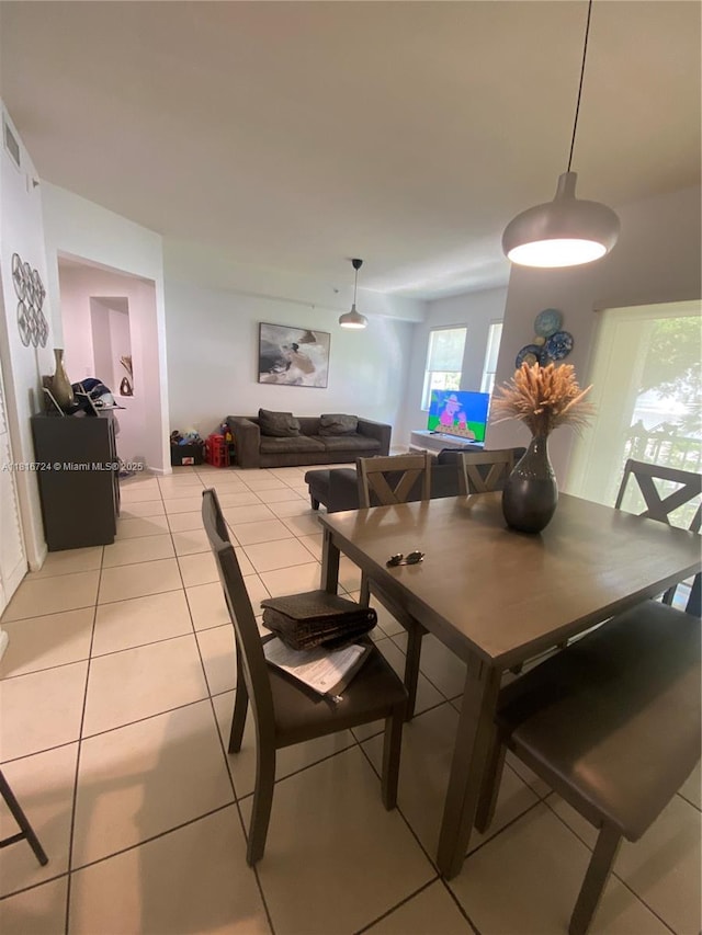 11603 NW 89th St Unit 214, Doral, FL 33178 - dining space with light tile patterned floors