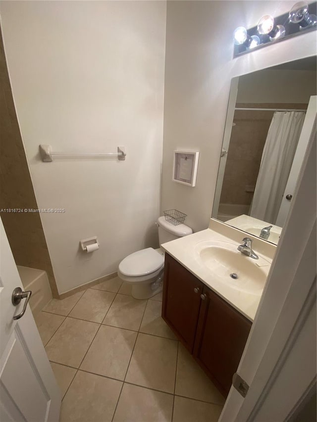 11603 NW 89th St Unit 214, Doral, FL 33178 - full bathroom featuring vanity, toilet, and tile patterned flooring