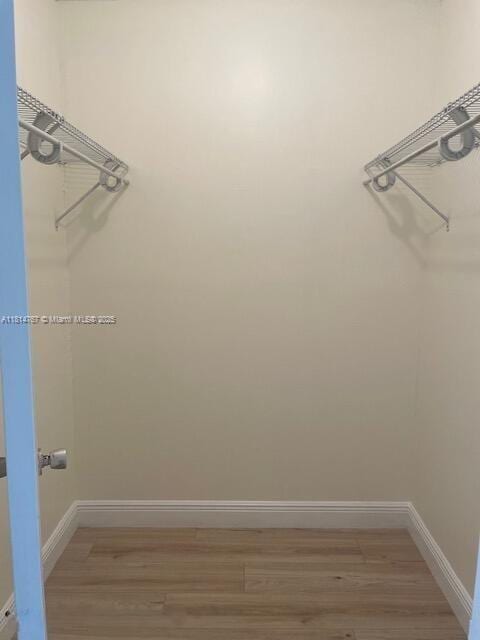 2751 N Palm Aire Dr Unit 504, Pompano Beach, FL 33069 - spacious closet with light wood-style flooring