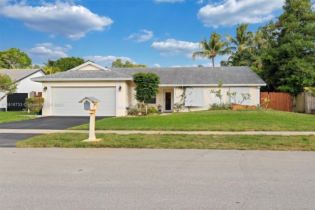 4760 SW 57th Ave, Davie, FL 33314 - ranch-style home with driveway, an attached garage, and stucco siding