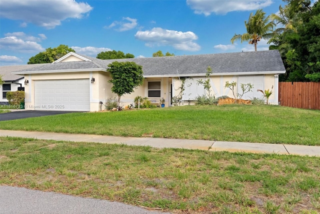 4760 SW 57th Ave, Davie, FL 33314 - ranch-style home with asphalt driveway, a garage, and stucco siding