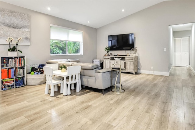 4760 SW 57th Ave, Davie, FL 33314 - living room featuring light wood-style floors, vaulted ceiling, recessed lighting, and baseboards