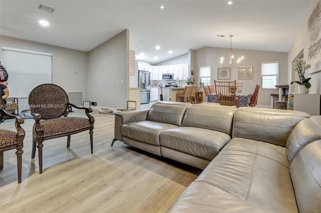 4760 SW 57th Ave, Davie, FL 33314 - living area featuring a chandelier, vaulted ceiling, light wood finished floors, and recessed lighting