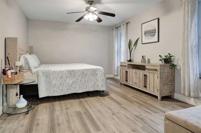4760 SW 57th Ave, Davie, FL 33314 - bedroom with light wood-type flooring, baseboards, and a ceiling fan