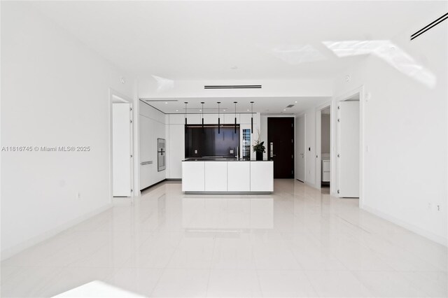 300 Biscayne Blvd Way Unit 3506, Miami, FL 33131 - unfurnished living room featuring baseboards and light tile patterned floors