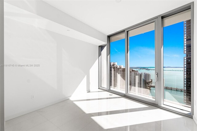 300 Biscayne Blvd Way Unit 3506, Miami, FL 33131 - empty room with a water view, healthy amount of natural light, and tile patterned flooring