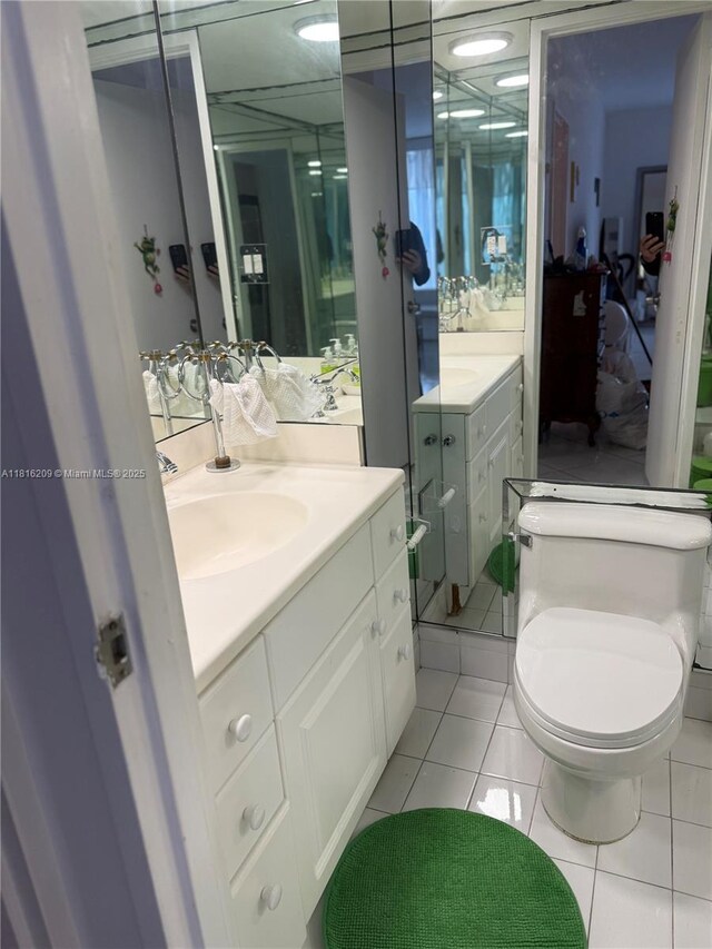 5161 Collins Ave Unit 216, Miami Beach, FL 33140 - bathroom with vanity, tile patterned flooring, and toilet