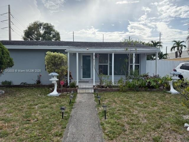 804 N 20th Ct, Hollywood, FL 33020 - view of front of home with a front yard and a sunroom
